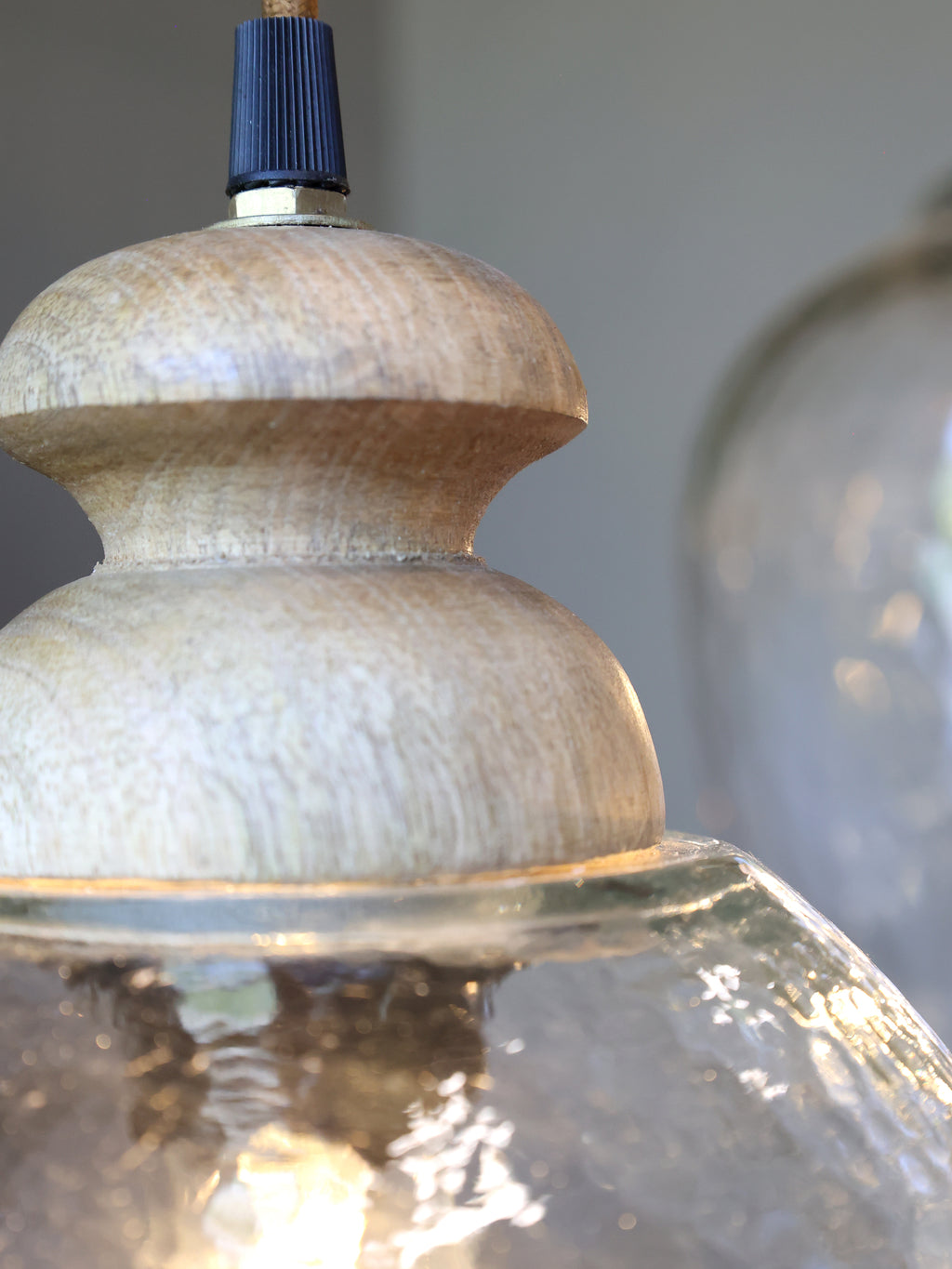 hammered glass pendant light close-up to see wood detail