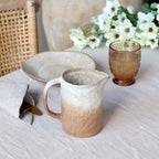 Valence milk jug in latte colour displayed on a breakfast table with neutral colour scheme